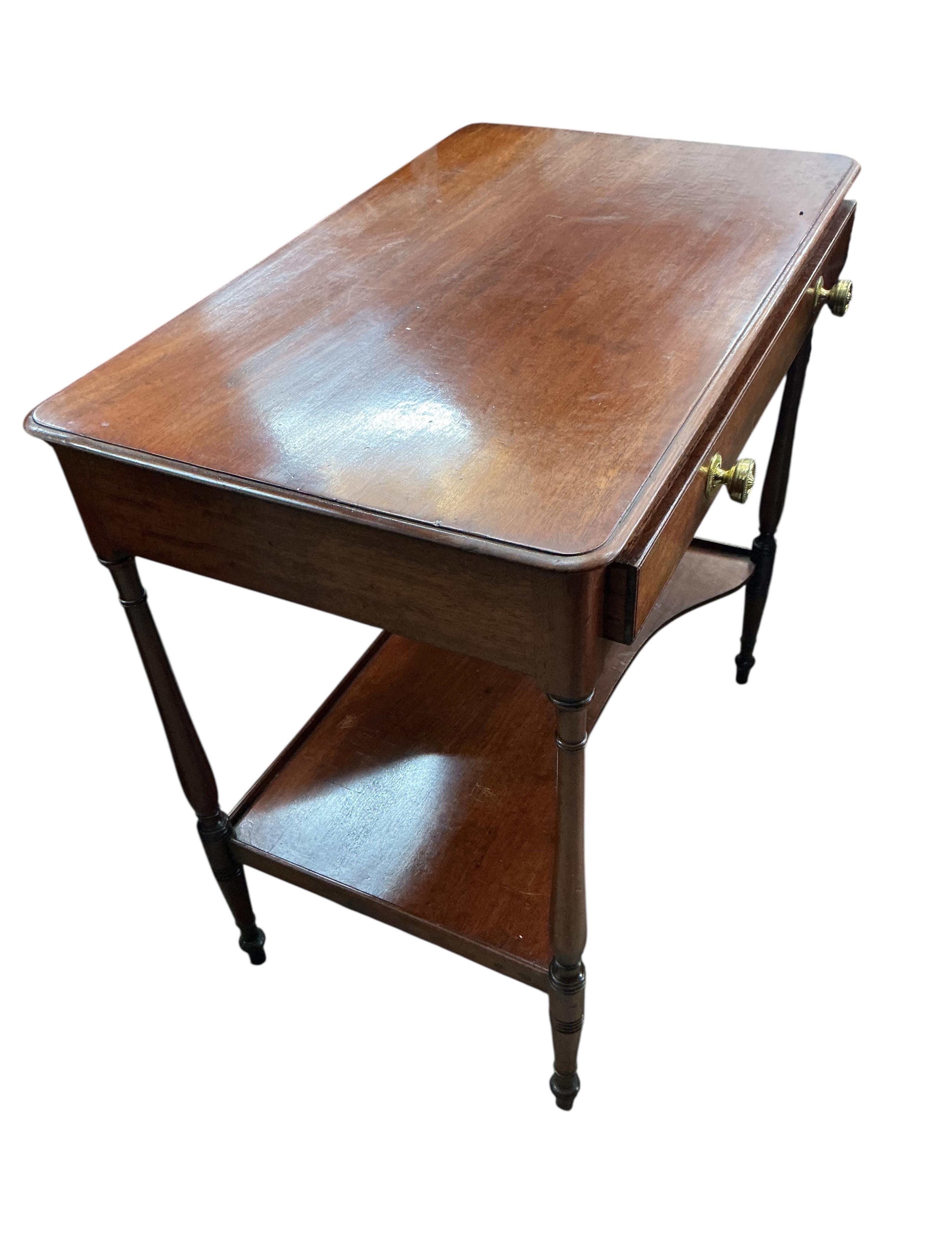 A small Victorian mahogany dressing table, with slender ring turned legs and undertier, width 74cm, depth 45cm, height 75cm